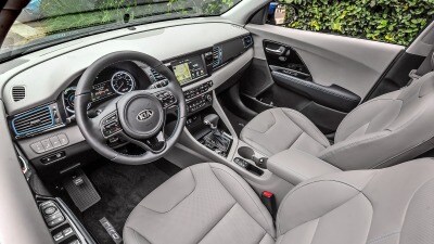 Kia Niro Incentives And Rebates Front Pengers In The 2018 Kia Niro Hybrid Suv Shown With A Gray Interior