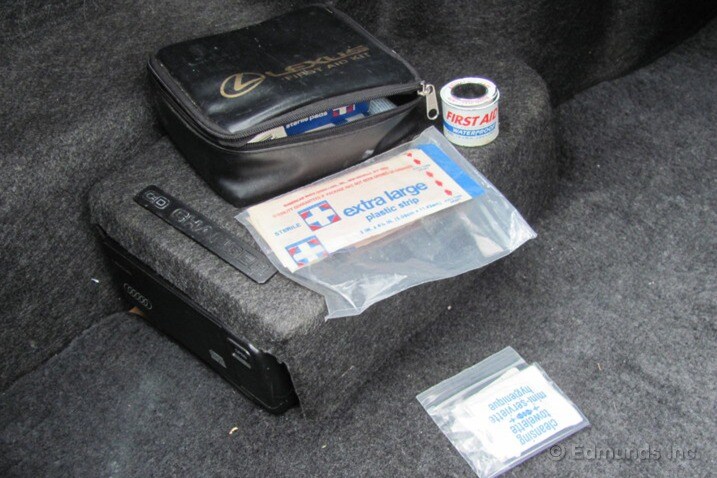 The first aid kit has been resting in the trunk, undisturbed, since the car was purchased some time in 1995 (note vintage bandages).