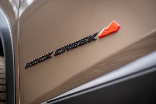 2026 Nissan Rogue Rock Creek 4dr SUV Fender Badge