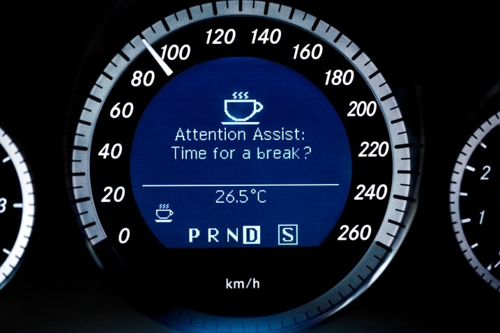 Mercedes-Benz's Attention Assist creates a driver profile and when there's a deviation from it, the system sounds a warning chime and displays a coffee cup icon.