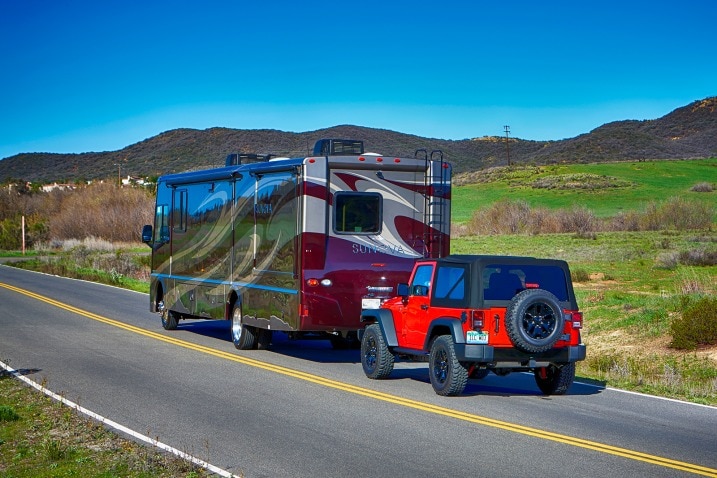 The Jeep Wrangler has long been a popular vehicle for motor home owners to flat tow, meaning that all four of the Jeep's wheels are on the ground.