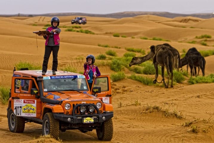 Amy Lerner (right) and her sister, Tricia Reina, get a fix on their position during the Rallye Aicha des Gazelles in Morocco.