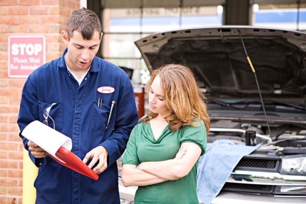 mechanic explaining to customer